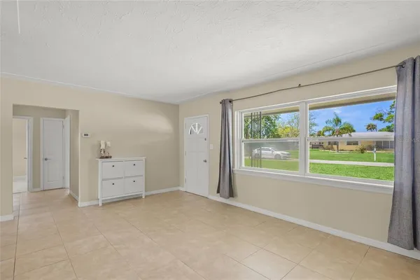a view of an empty room with a window