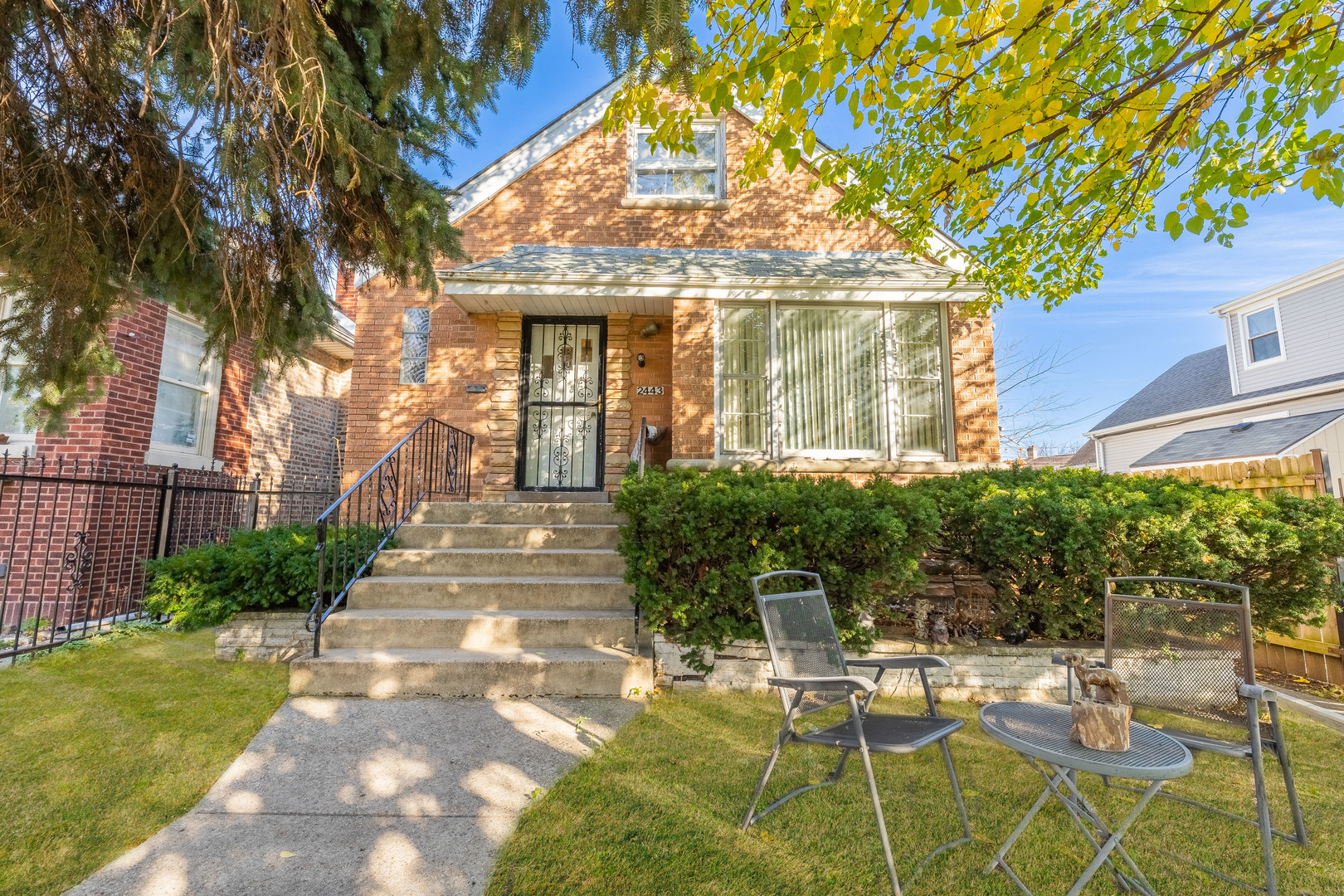 2443 North McVicker Avenue Chicago, IL 60639 - Photo 1 of 23 a view of patio with table and chairs and potted plants
