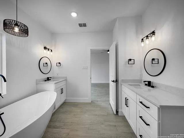 a view of bathroom with dual sinks