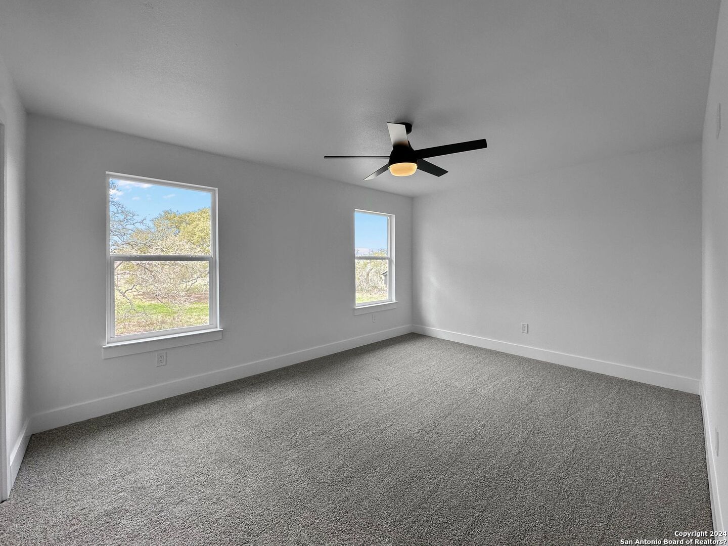 142 North Lon Price Blanco, TX 78606 - Photo 7 of 14 an empty room with windows