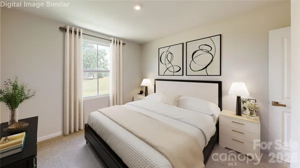 a bedroom with a bed and a potted plant
