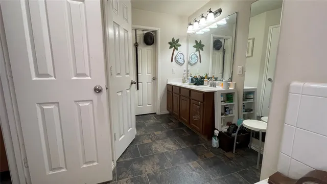 a bathroom with a double vanity sink and a mirror