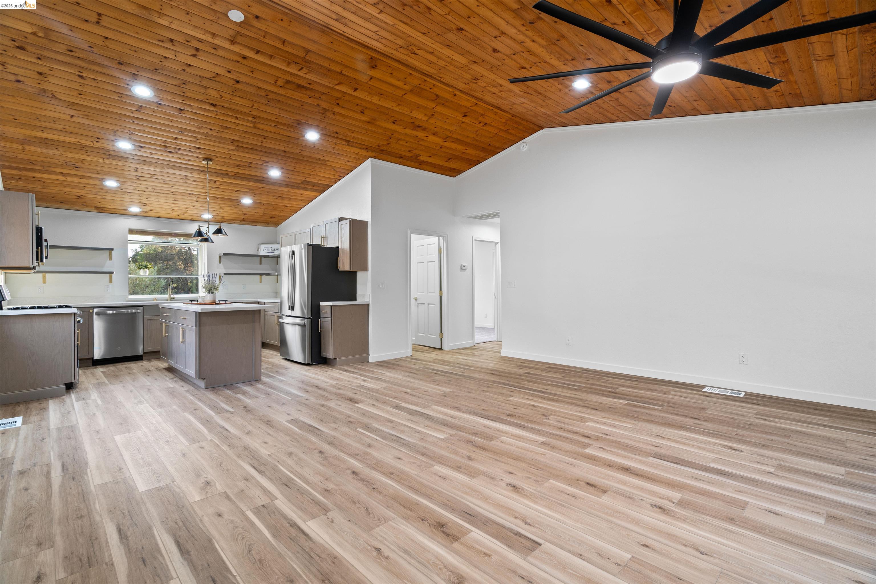 19676 Rawhide Road Sonora, CA 95370 - Photo 11 of 67 Vaulted wood-finish ceiling, wood-finish flooring, kitchen island, stainless steel appliances, and recessed lighting