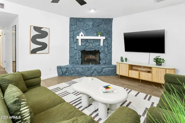 a living room with furniture and a flat screen tv