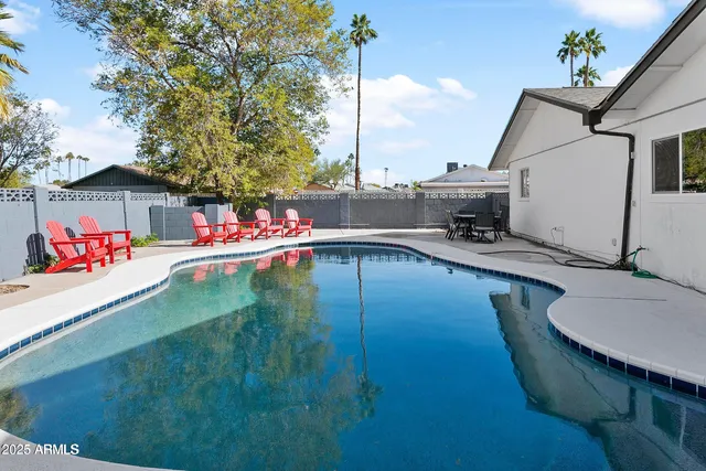 a swimming pool with barbeque oven