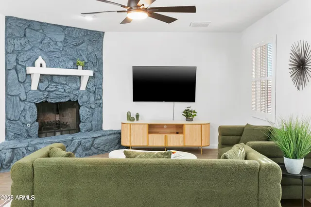 a living room with furniture and a flat screen tv