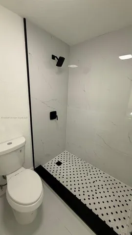 a view of an empty room with stairs