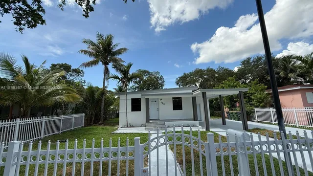 a view of house with roof deck and furniture