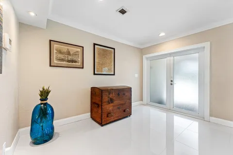 a view of room with furniture and a potted plant