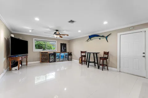 a view of a livingroom with furniture and a flat screen tv