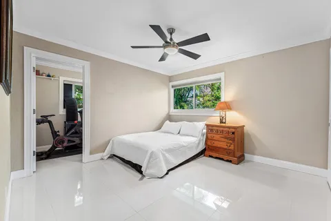 a bedroom with bed and window