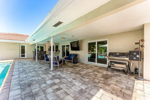 a view of a chairs and table in a patio