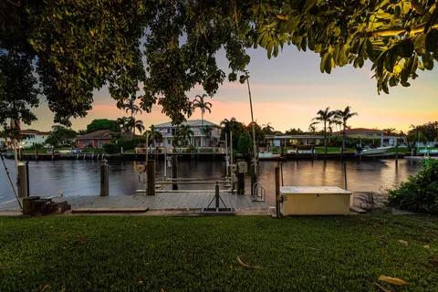 a view of a lake with houses in the background