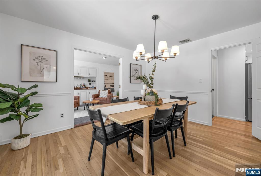 15 Cobbler Lane Mahwah, NJ 07430 - Photo 16 of 50 a view of a dining room with furniture wooden floor and chandelier
