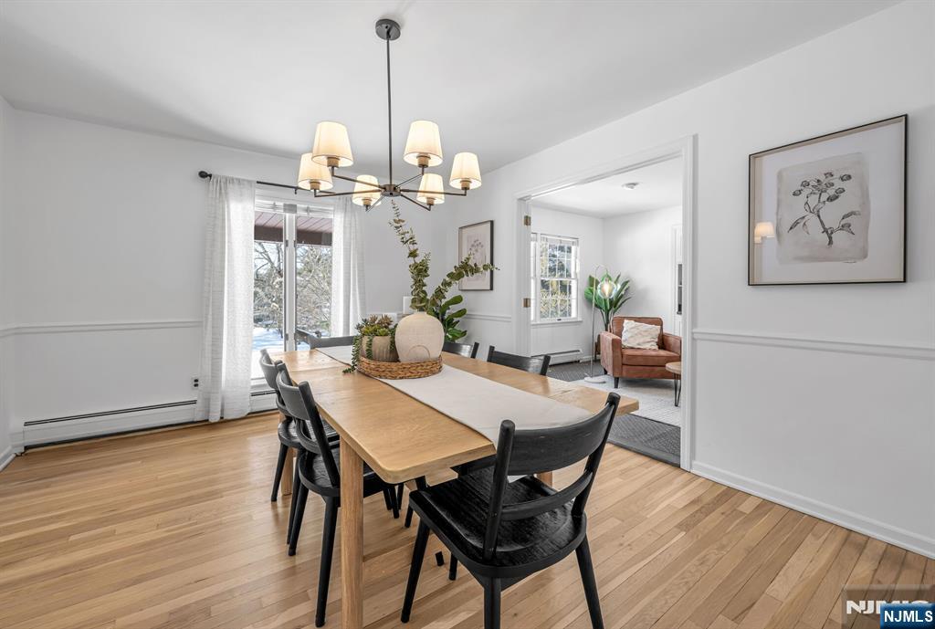 15 Cobbler Lane Mahwah, NJ 07430 - Photo 17 of 50 a view of a dining room with furniture wooden floor and chandelier