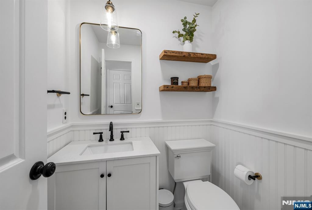 15 Cobbler Lane Mahwah, NJ 07430 - Photo 20 of 50 a bathroom with a sink a toilet and a mirror