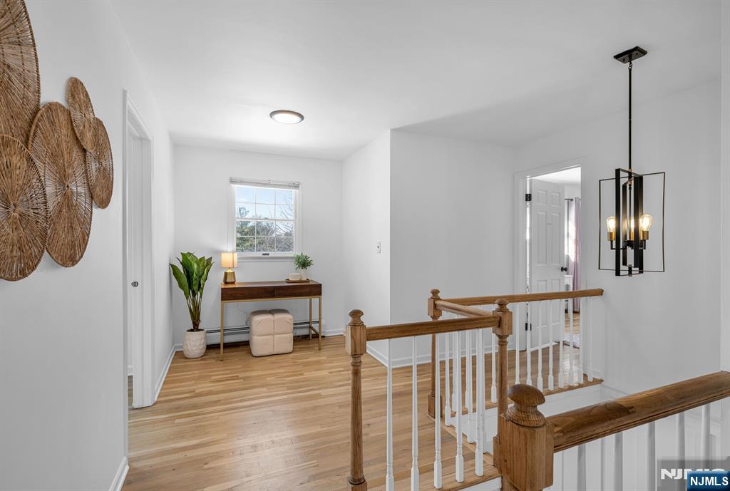 15 Cobbler Lane Mahwah, NJ 07430 - Photo 22 of 50 a bedroom with furniture and a wooden floor