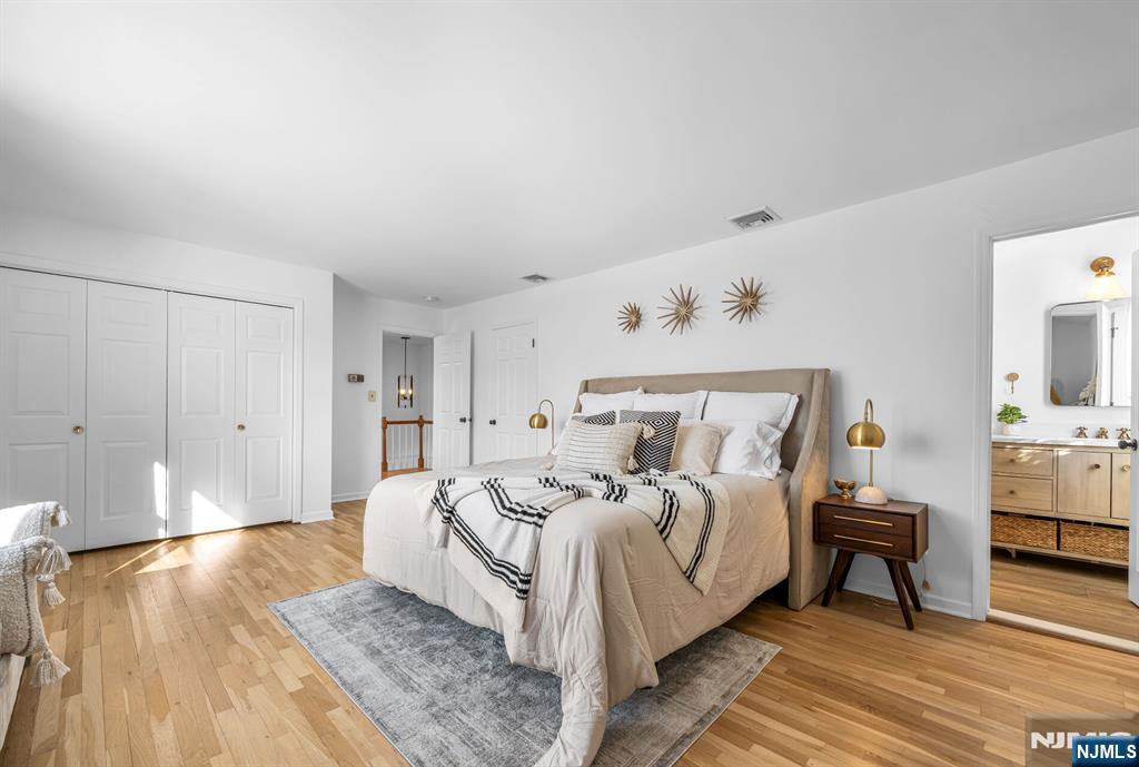 15 Cobbler Lane Mahwah, NJ 07430 - Photo 24 of 50 a bed room with a bed and a couch