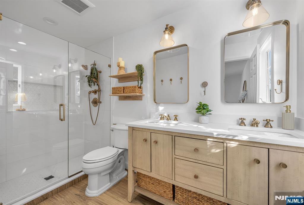 15 Cobbler Lane Mahwah, NJ 07430 - Photo 25 of 50 a bathroom with a toilet sink and shower