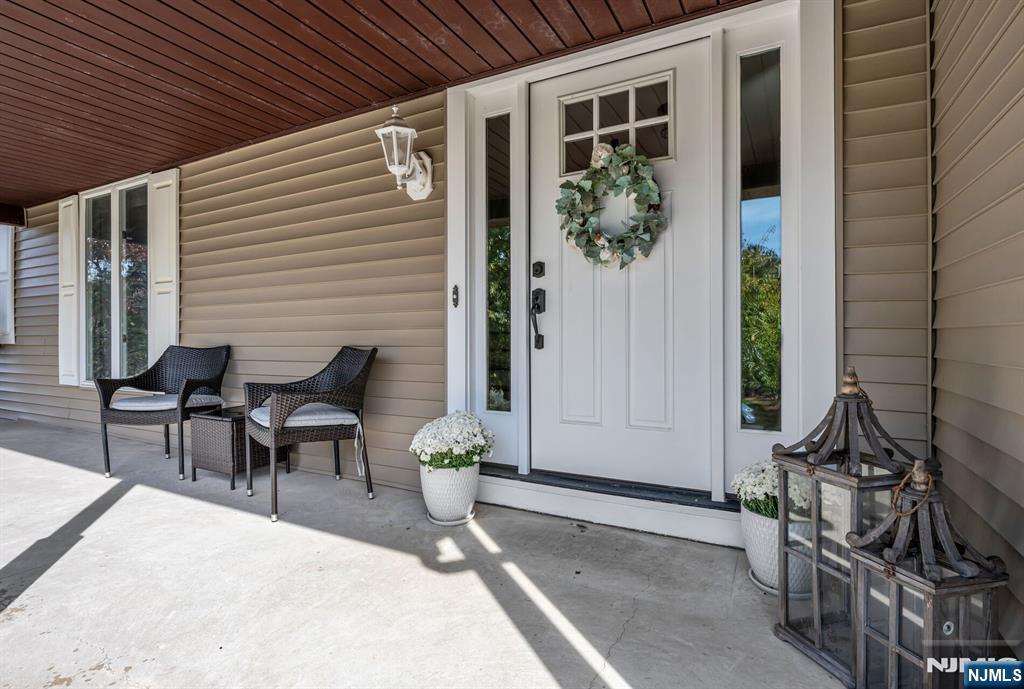 15 Cobbler Lane Mahwah, NJ 07430 - Photo 3 of 50 a view of a porch with chairs and potted plants