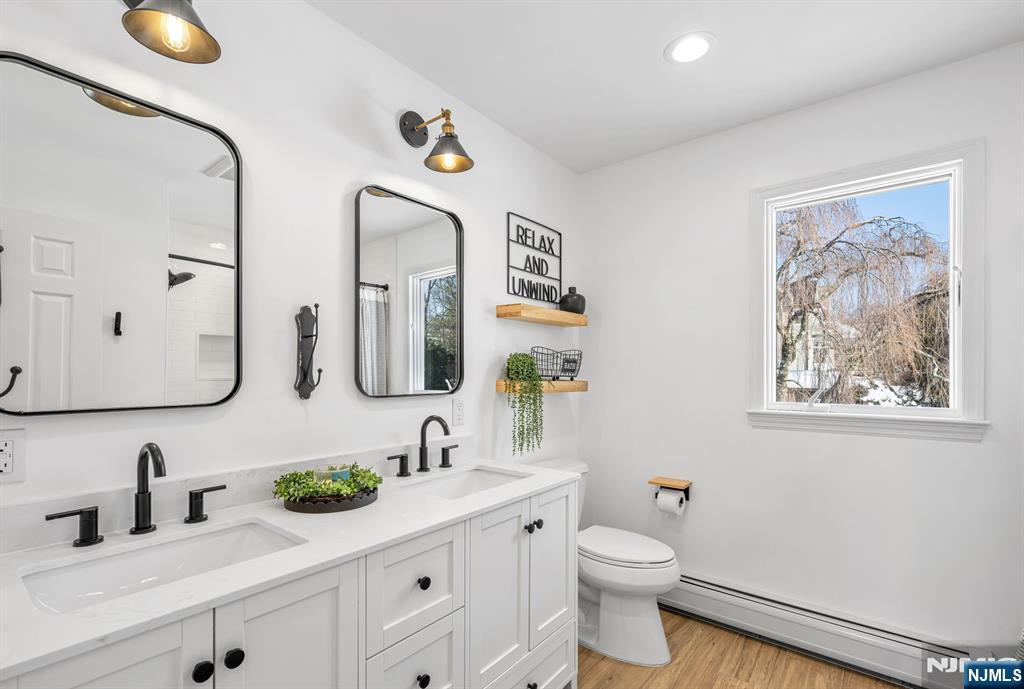 15 Cobbler Lane Mahwah, NJ 07430 - Photo 33 of 50 a bathroom with a toilet sink and mirror