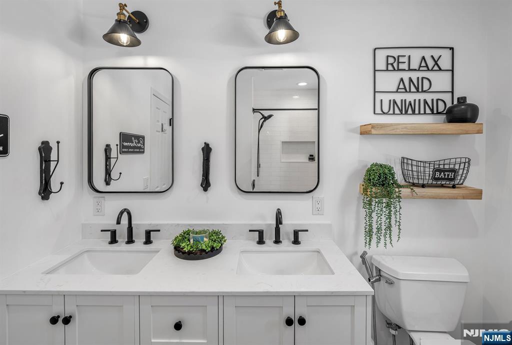 15 Cobbler Lane Mahwah, NJ 07430 - Photo 34 of 50 a bathroom with sink and a mirror