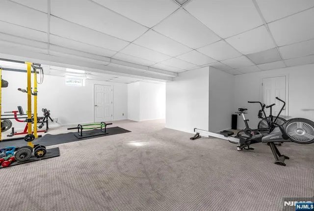 a view of a deck with table and chairs with wooden floor and fence