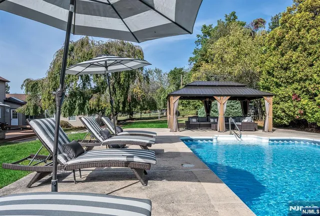 a living room with kitchen island furniture and a kitchen view