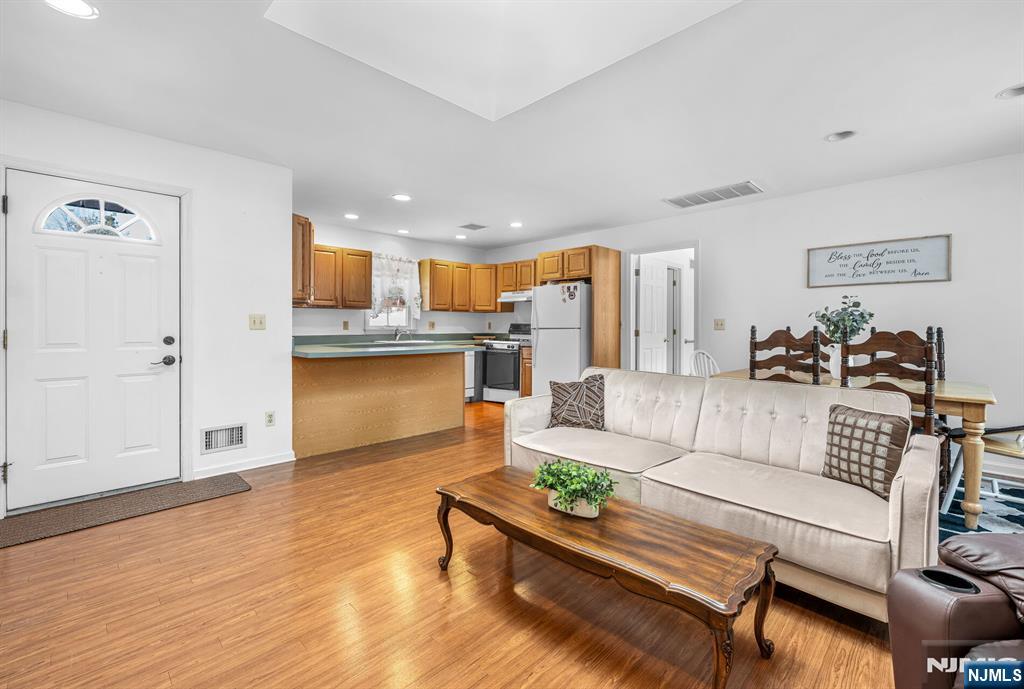 15 Cobbler Lane Mahwah, NJ 07430 - Photo 47 of 50 a living room with kitchen island furniture and a kitchen view