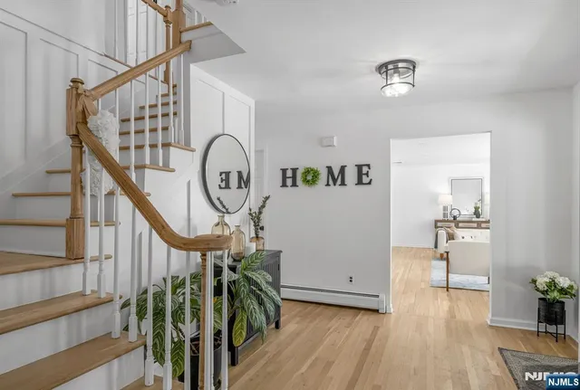 a view of an entryway with wooden floor
