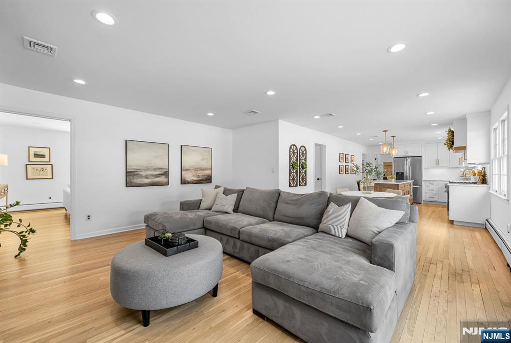 15 Cobbler Lane Mahwah, NJ 07430 - Photo 9 of 50 a living room with furniture and a wooden floor