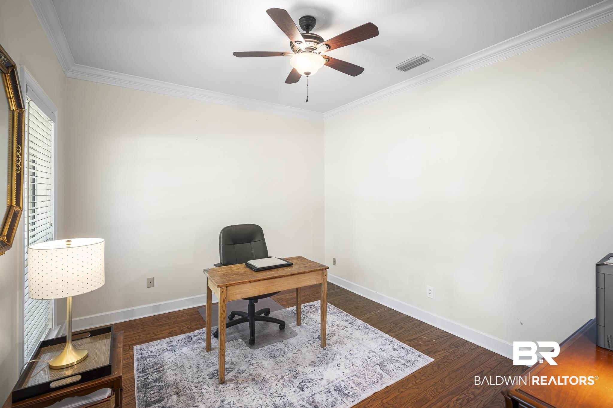 402 Potters Mills Road Daphne, AL 36526 - Photo 9 of 45 Office area featuring ornamental molding, a ceiling fan, baseboards, and dark wood-style flooring