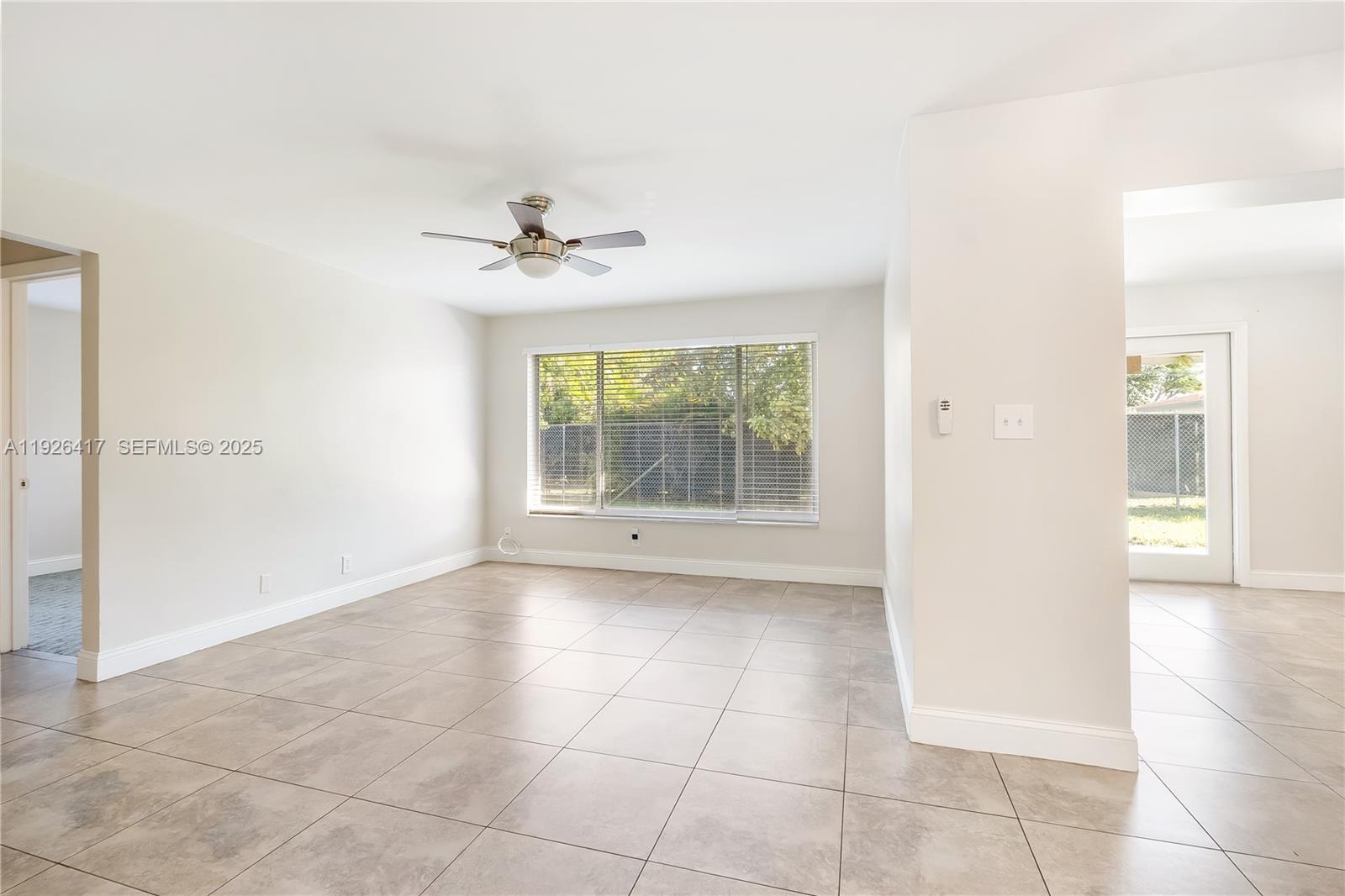 8172 Northwest 67th Avenue Tamarac, FL 33321 - Photo 1 of 44 a view of an empty room with a window