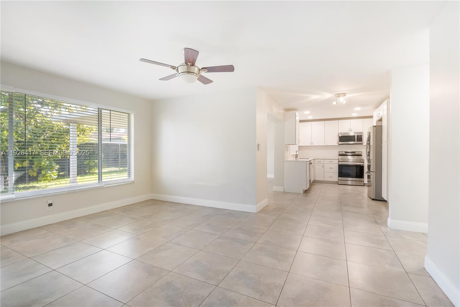 8172 Northwest 67th Avenue Tamarac, FL 33321 - Photo 11 of 44 a view of a kitchen with furniture and a kitchen