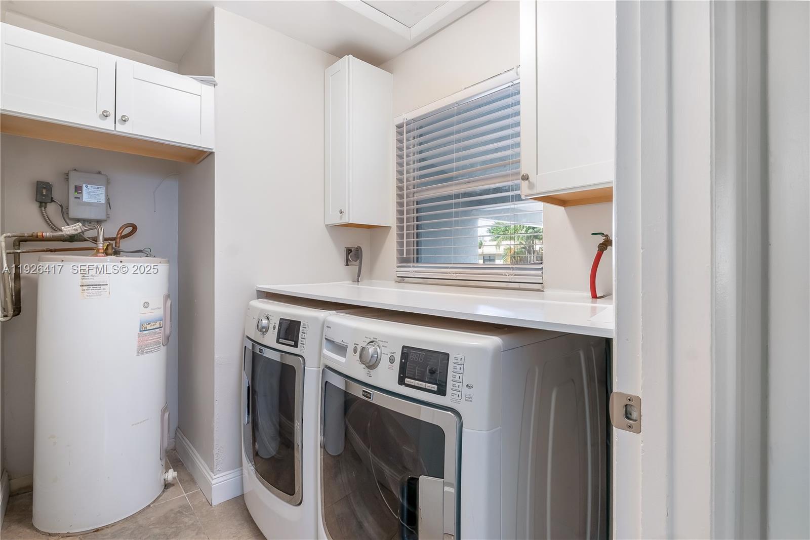 8172 Northwest 67th Avenue Tamarac, FL 33321 - Photo 20 of 44 a utility room with dryer and washer