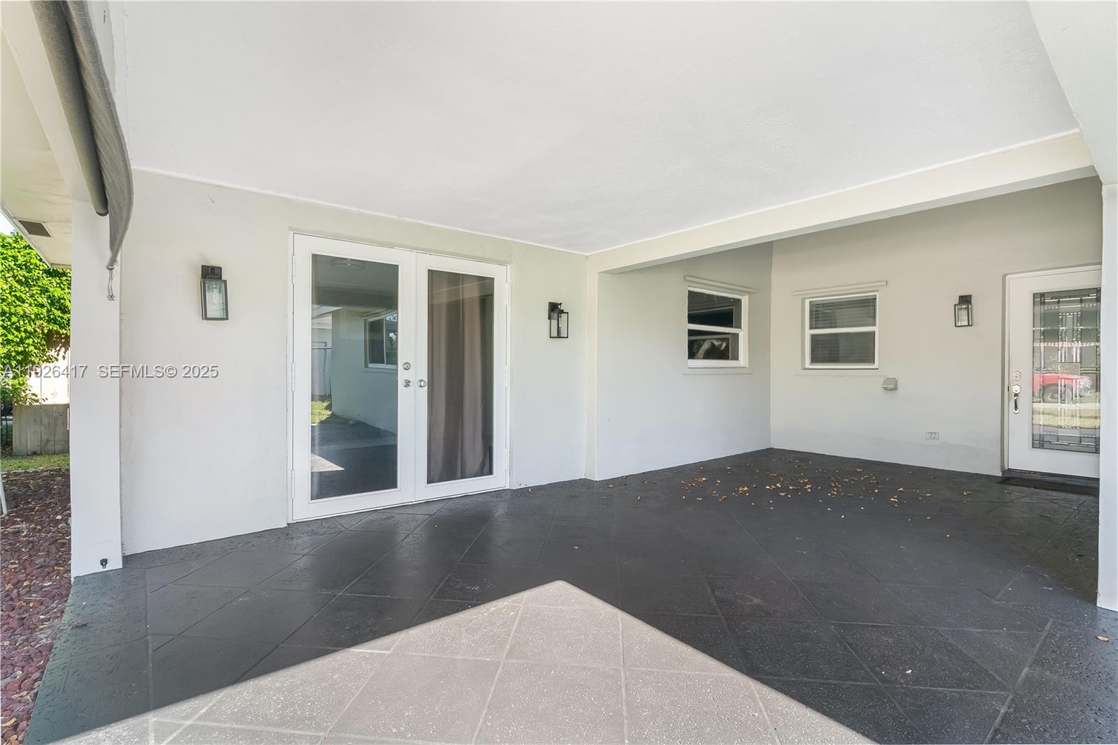 8172 Northwest 67th Avenue Tamarac, FL 33321 - Photo 29 of 44 a view of an empty room with wooden floor and a window