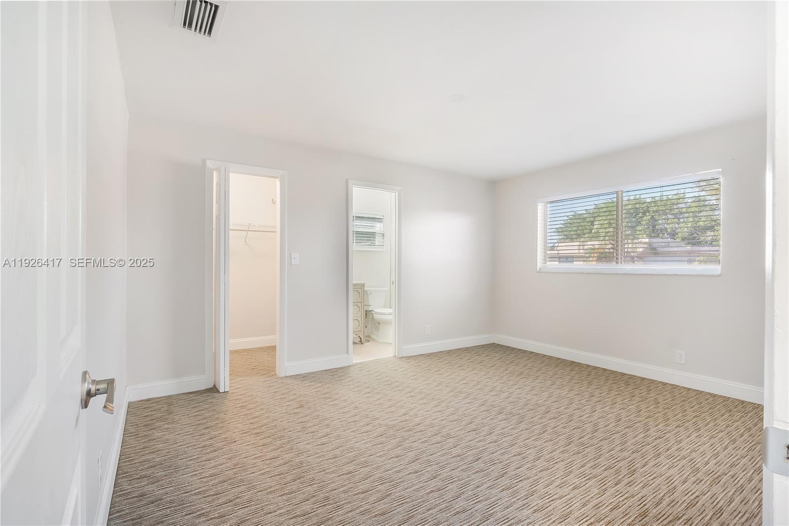 8172 Northwest 67th Avenue Tamarac, FL 33321 - Photo 30 of 44 an empty room with windows