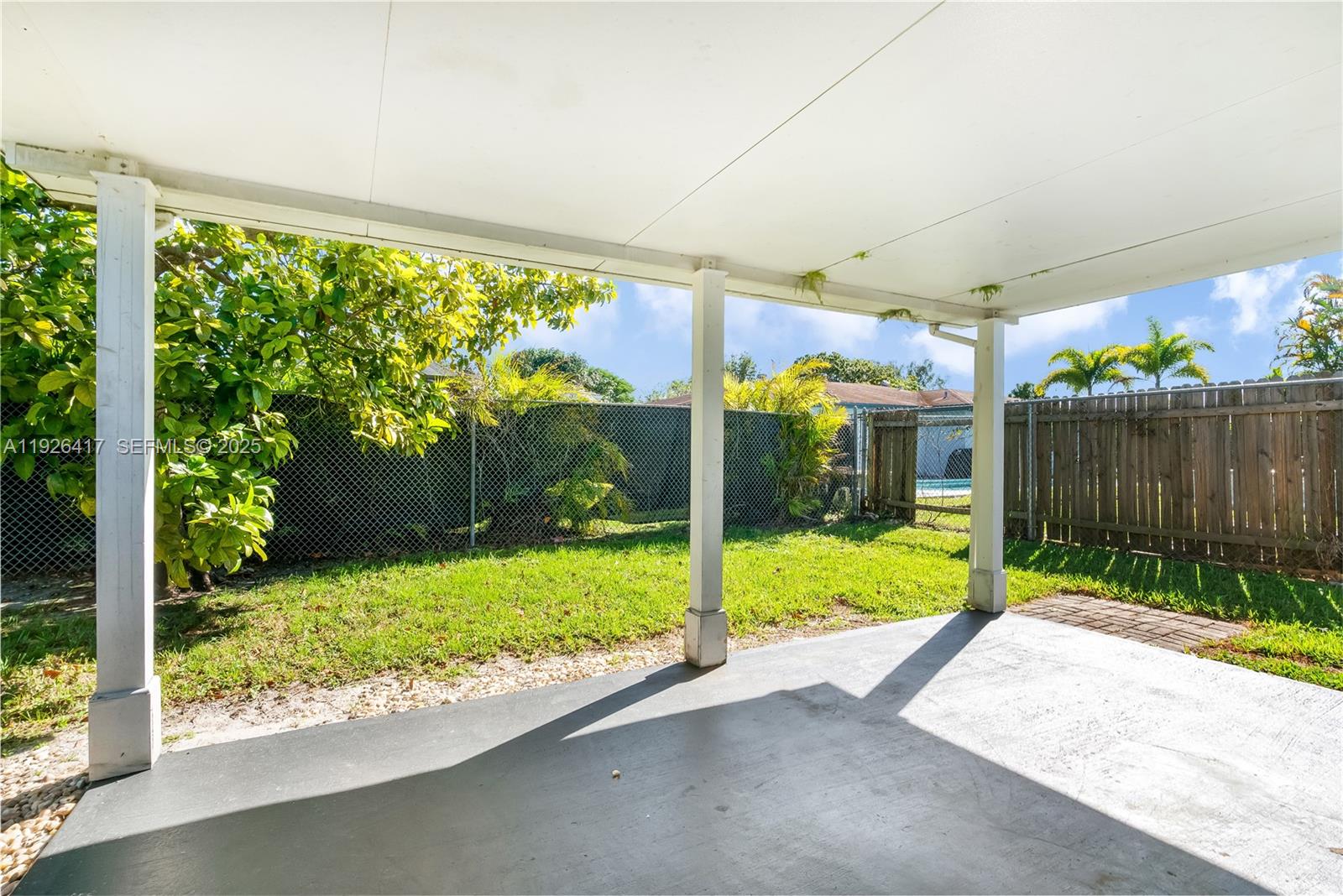 8172 Northwest 67th Avenue Tamarac, FL 33321 - Photo 33 of 44 a view of a porch with a backyard