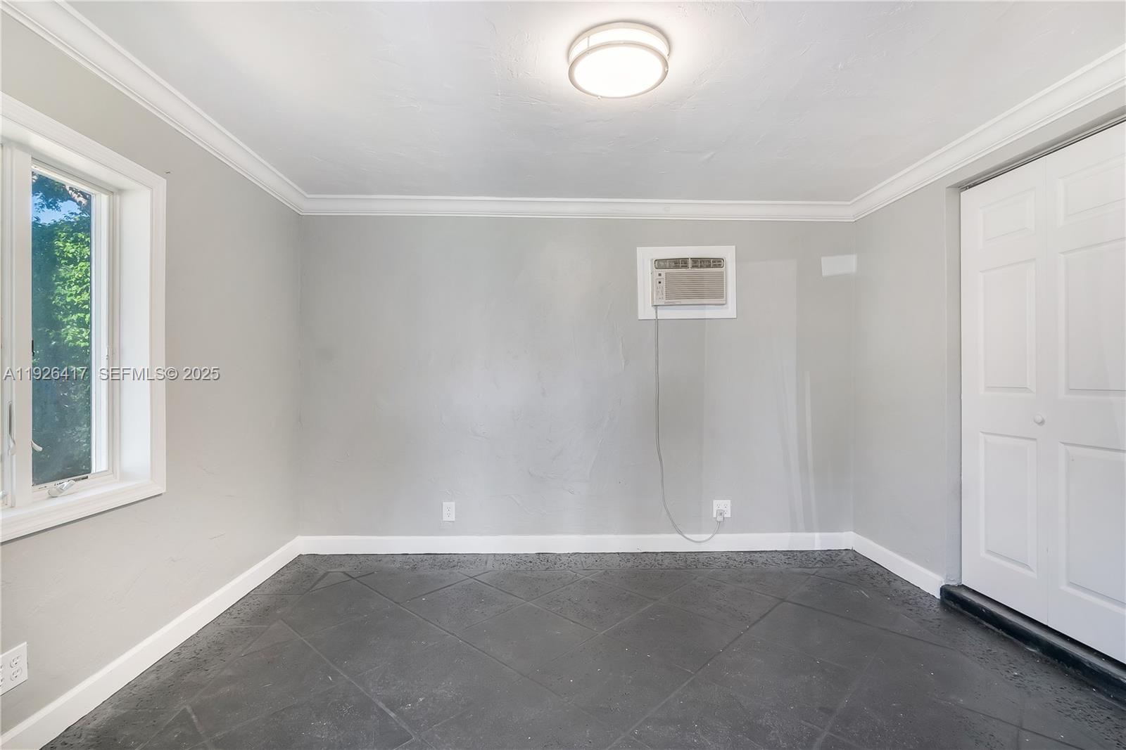 8172 Northwest 67th Avenue Tamarac, FL 33321 - Photo 36 of 44 an empty room with a window