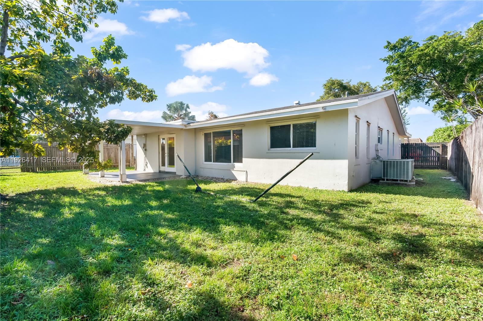 8172 Northwest 67th Avenue Tamarac, FL 33321 - Photo 38 of 44 a view of a house with a backyard