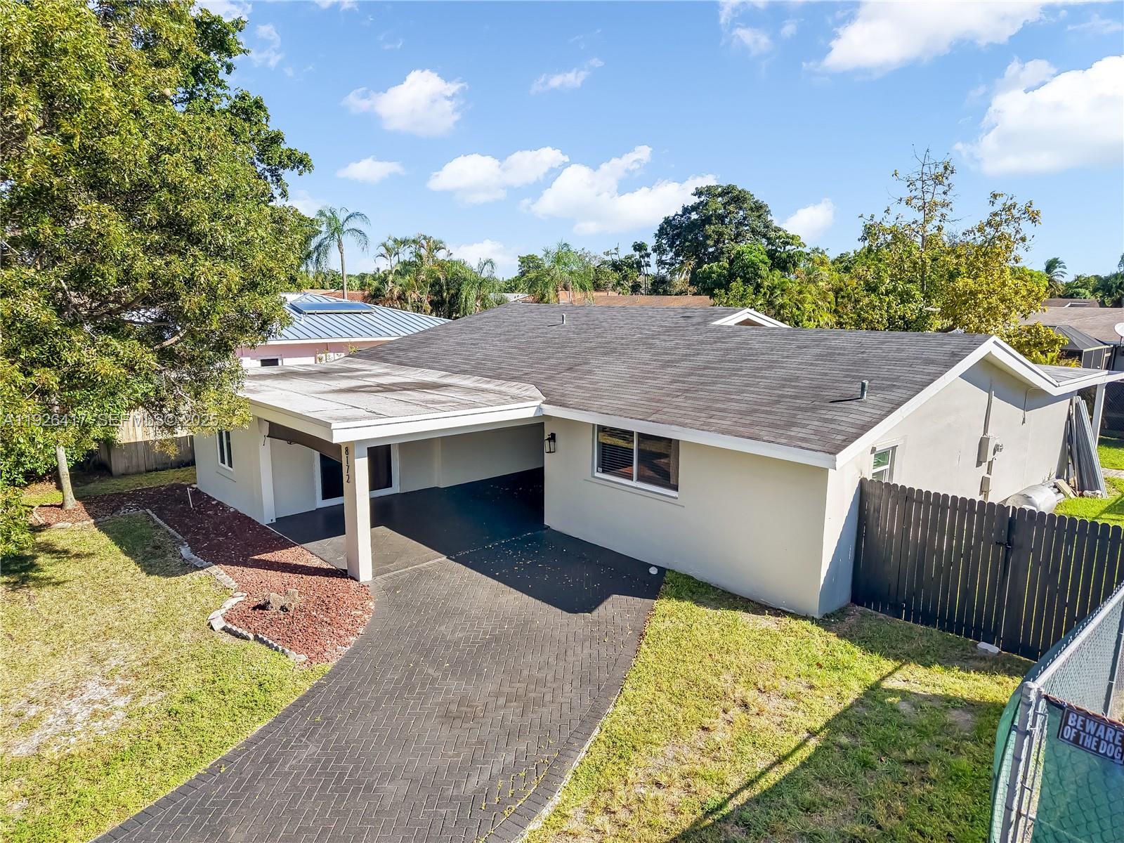 8172 Northwest 67th Avenue Tamarac, FL 33321 - Photo 39 of 44 a view of a backyard with a patio