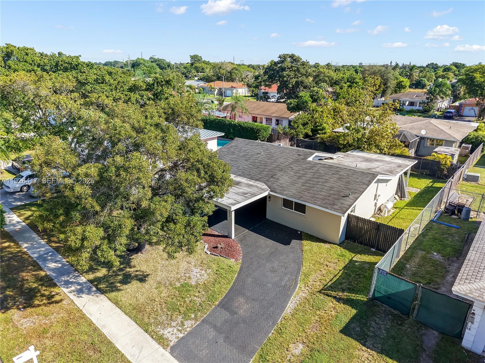 8172 Northwest 67th Avenue Tamarac, FL 33321 - Photo 42 of 44 an aerial view of a house with a yard