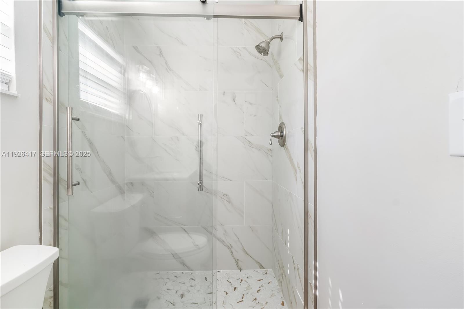 8172 Northwest 67th Avenue Tamarac, FL 33321 - Photo 9 of 44 a bathroom with a shower