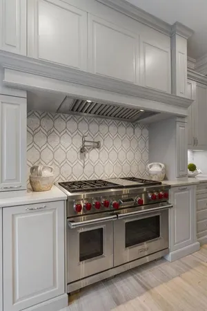 a living room with furniture a rug and a chandelier