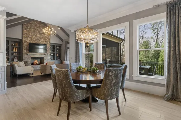 a bathroom with a granite countertop sink mirror and a shower