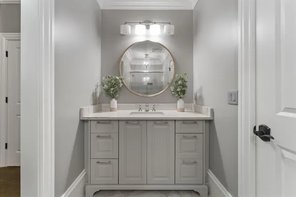 a kitchen with kitchen island a sink appliances and cabinets