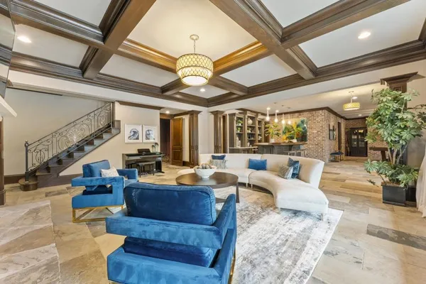 a bedroom with two beds and a couch with window