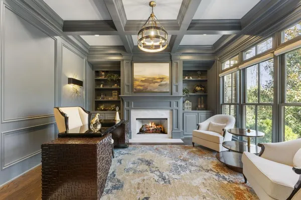 a kitchen with stainless steel appliances granite countertop a sink a stove top oven a counter space and cabinets