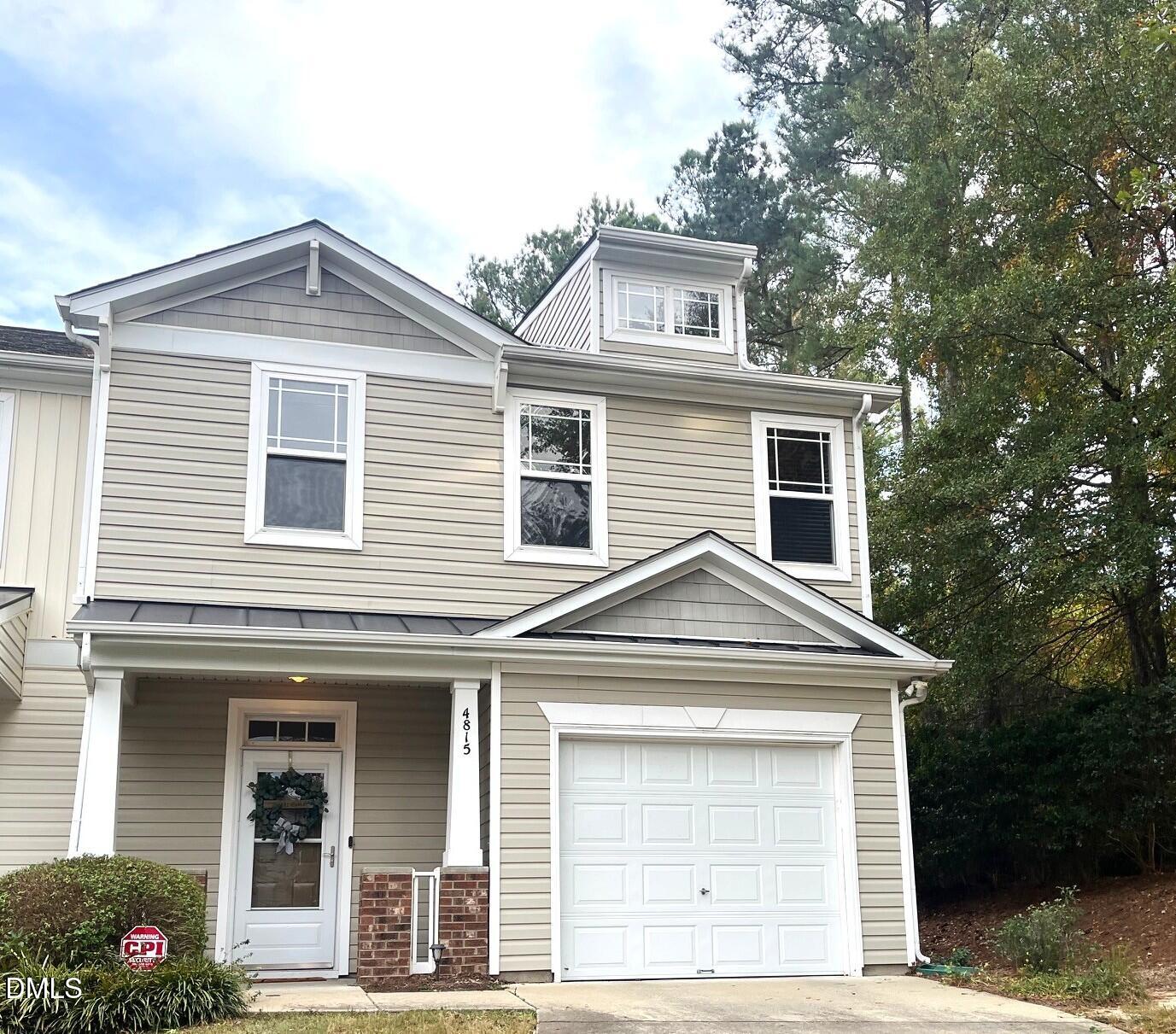 4815 Landover Charge Lane Raleigh, NC 27616 - Photo 1 of 18 a front view of a house with parking