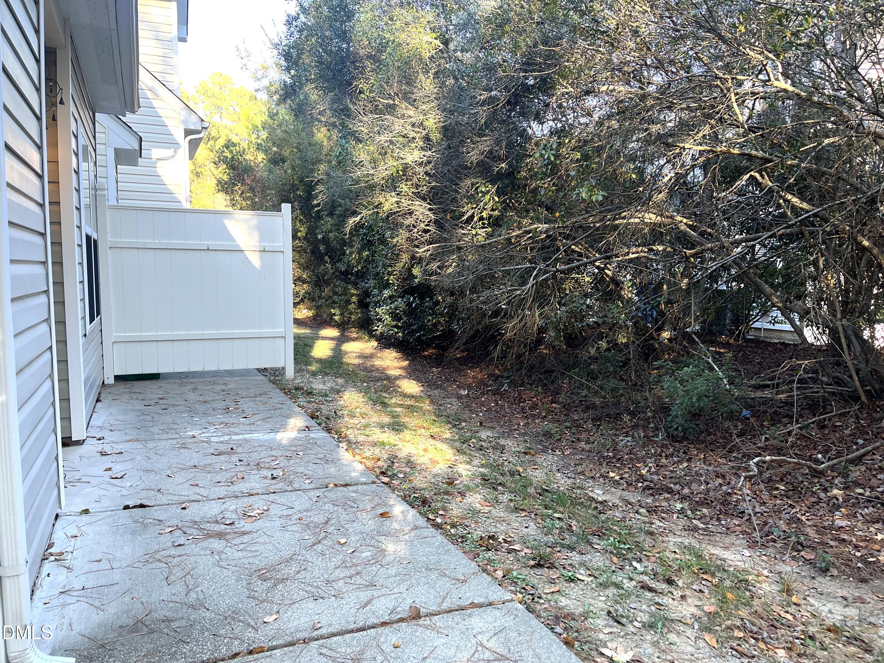4815 Landover Charge Lane Raleigh, NC 27616 - Photo 16 of 18 a view of a yard with plants and trees